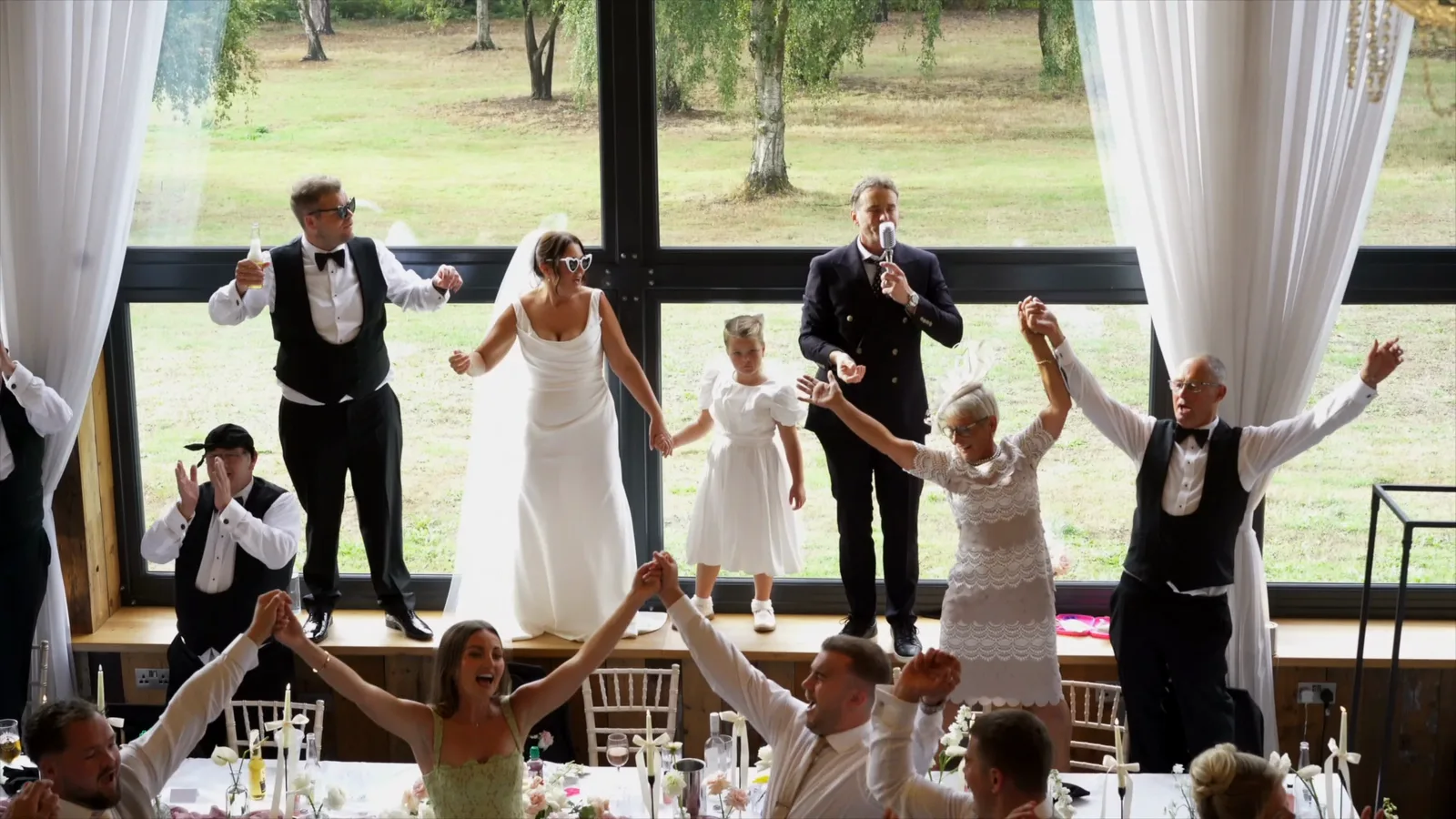 Jamie and Lucy's wedding at Bunny Hill Weddings, the whole room up on the tables with Howard