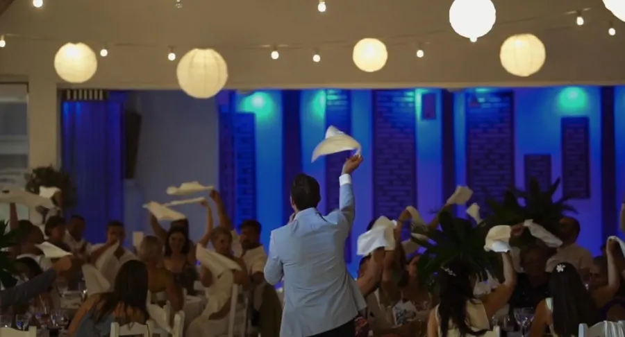 The whole room waving napkins back at Howard in Cyprus