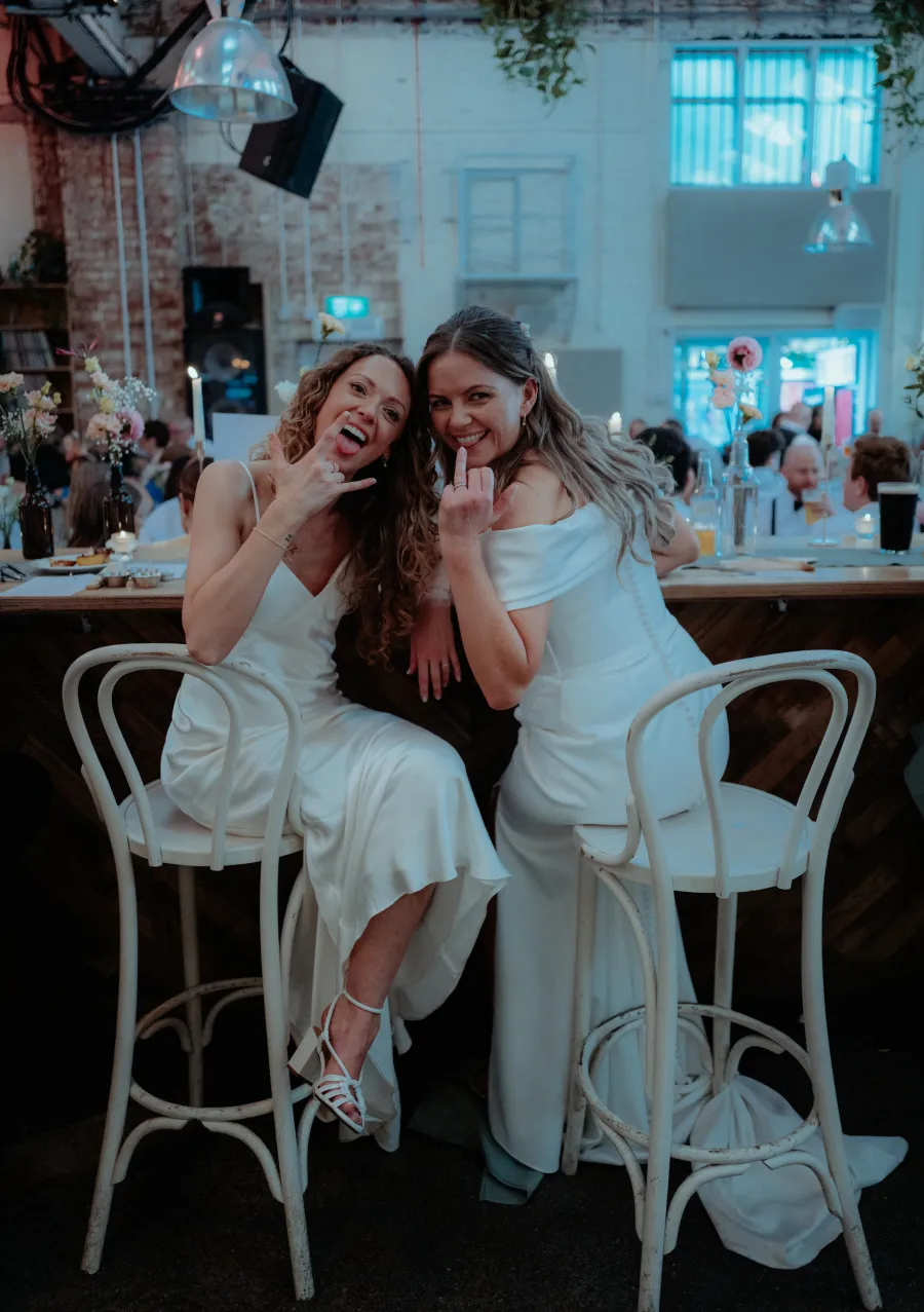 Fran and Nicole, rings out, at their Firehouse wedding