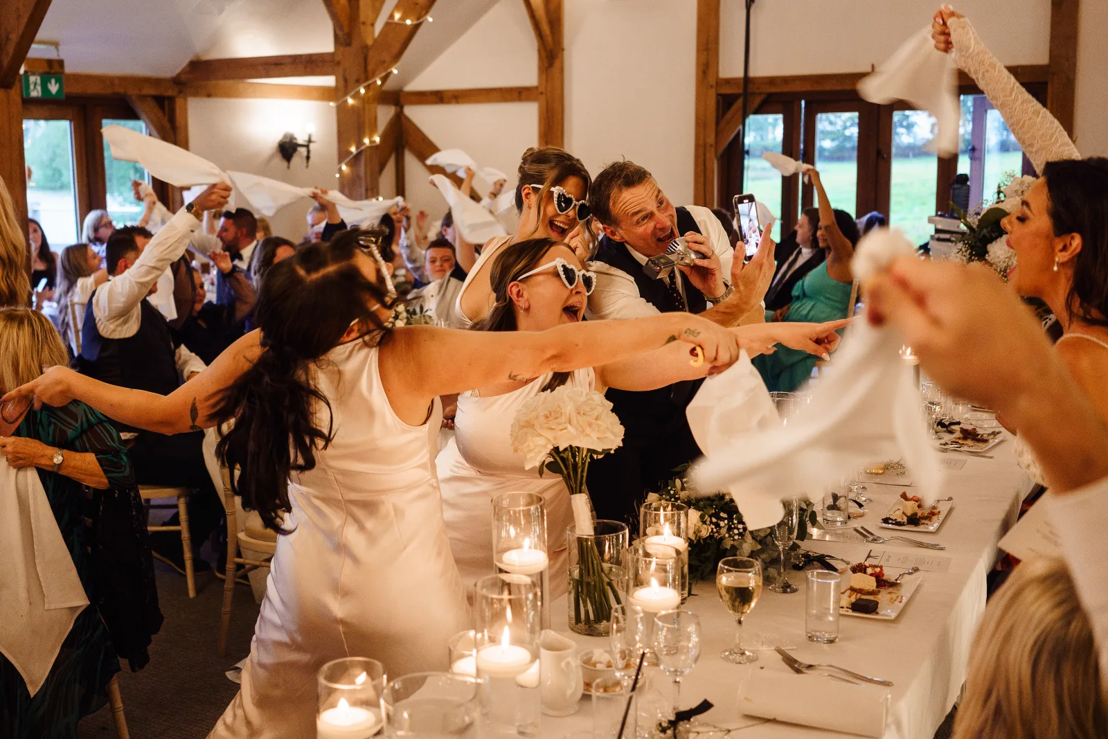 A wedding breakfast with every table waving napkins in the air as Howard sings