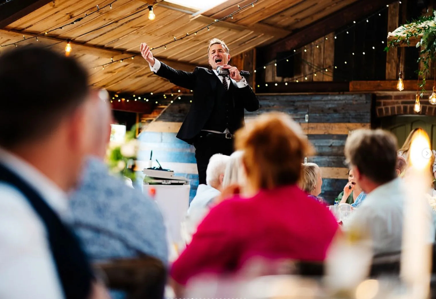 Howard singing to the room at Owen House Barn, Mobberley